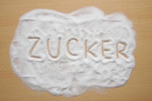 German word Zucker written in sugar photo