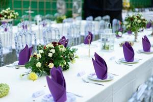 Luxury White - Purple - Red Dinner table set with Crystal chair in the garden. photo