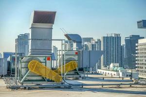 The industrial machine at the rooftop of the huge building. photo