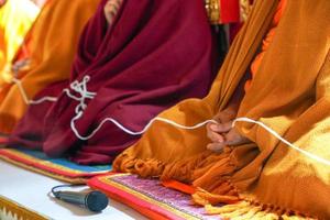 holy thread in monk hands photo