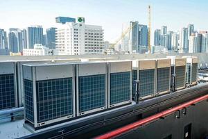 The industrial machine at the rooftop of the huge building. photo