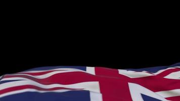 United Kingdom fabric flag waving on the wind loop. United Kingdom embroidery stiched cloth banner swaying on the breeze. Half-filled black background. Place for text. 20 seconds loop. 4k video