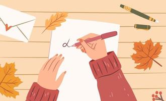 manos de mujer con bolígrafo escribiendo una carta en una hoja de papel. vista superior. hojas de arce otoñales en el escritorio, sobre de cartas, bolígrafos. acogedora ilustración de otoño. diseño vectorial plano. vector