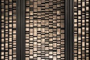 Random battens steel and pole are set in front of hotel wallpaper for backdrop and background. photo