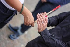 incense fire hand to hand. photo