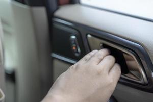 man hands to open the door car from inside. photo