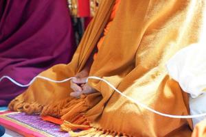 holy thread in monk hands photo