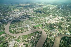 Beautiful Curve River was shot on the plane in the noon. It can see farming and valley all around. photo