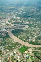 Beautiful Curve River was shot on the plane in the noon. It can see farming and valley all around. photo