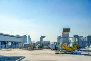 The industrial machine at the rooftop of the huge building. photo