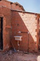 An outdoor sink in the back of a house used for washing clothes which is typical throughout Brazil photo