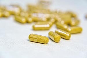 Pharmacy theme, Heap of brown round capsule pills photo