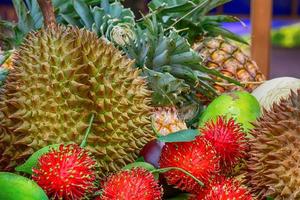 Many fruits stacks wait for a sale. photo