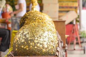 Gilding Loknimit is a ritual of Buddhism. photo