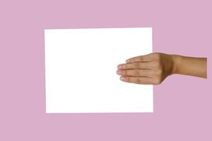 Hand are holding white paper photo