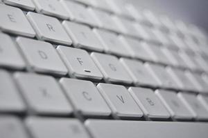 Computer Keyboard with white Keys. photo