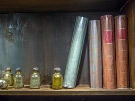 Potions and books on shelf photo