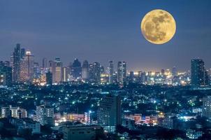 Surreal Bangkok cityscape in Thailand under full moon post production for imagination photo