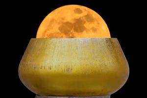 Super moon in alms bowl photo