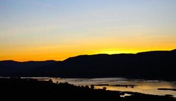 Before sunrise behind mountain photo