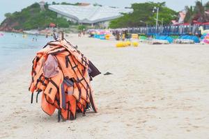 Life jacket hang on beach with copy space at koh larn pattaya photo