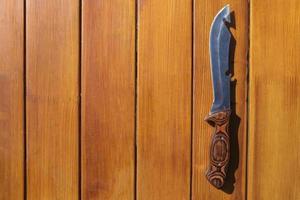 Knife for cooking on a wooden table photo