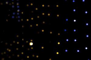 Black background with golden light effects. background with  Blur bokeh effects. Abstract background texture photo