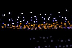Black background with golden light effects. background with  Blur bokeh effects. Abstract background texture photo