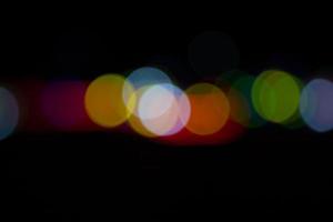 Black background with colorful light bokeh effects. background with  Blur bokeh effects. Abstract background texture photo