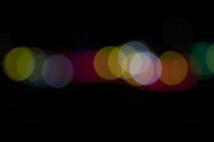 Black background with colorful light bokeh effects. background with  Blur bokeh effects. Abstract background texture photo