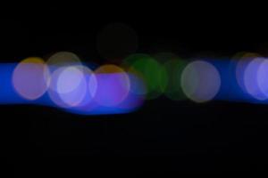 Black background with colorful light bokeh effects. background with  Blur bokeh effects. Abstract background texture photo