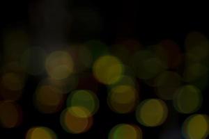 Abstract bokeh light effects on the night. Black background with colorful light effects. background with  Blur bokeh effects. Abstract background texture photo