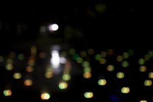 Abstract bokeh light effects on the night. Black background with colorful light effects. background with  Blur bokeh effects. Abstract background texture photo