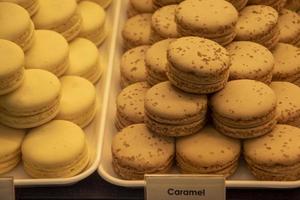 A macaron or French macaroon is a sweet meringue-based confection made with egg white, icing sugar, granulated sugar, almond meal, and food colouring. photo