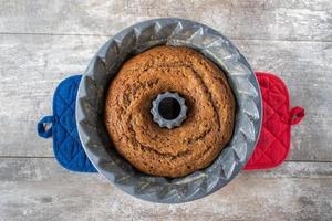 patriotic baked gingerbread cake in decorative mold baking pan flat lay photo