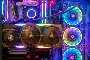 inside desktop pc gaming and cooling fan cpu with multicolored led rgb light show status on working mode, interior pc case technology background