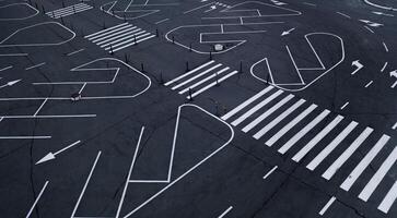 White road markings for traffic in the parking lot photo