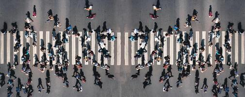 Crowd of people at pedestrian crossing in the city - overhead panorama shot of people pedestrians