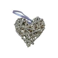 Decorative wicker heart with a light violet ribbon cutout on the white background photo