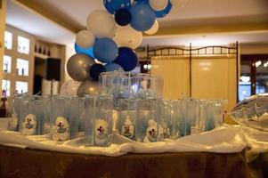 baptism favors with decoration in the restaurant photo