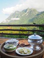 Side view of Thai foods traditionally dinner with mountains background