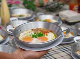 Breakfast with fried eggs in a pan photo