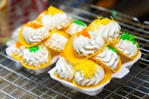 Thai crispy pancakes placed on foam cups. Khanom buang photo