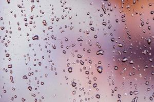 raindrops on the window in rainy days, abstract background photo