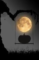 Halloween night background with moon, spider and pumpkin sitting on swings under the old tree. photo