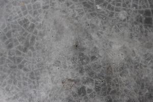 Broken concrete close-up photoshoot surface texture. Cement wall with gray color texture and grunge effect photo. Cracked concrete texture in the vintage gray color floor close-up shot. photo