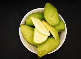 Closeup of Fresh Green Mangoes photo