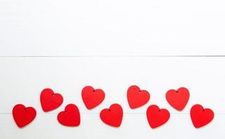 Red Heart with love on wooden background, 14 February Valentine day on wood, on grunge white wood, celebration and holiday concept, top view. photo