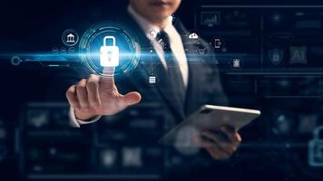 Cybersecurity and privacy concepts to protect data. Lock icon and internet network security technology. Businessmen protecting personal data on tablets and virtual interfaces. photo