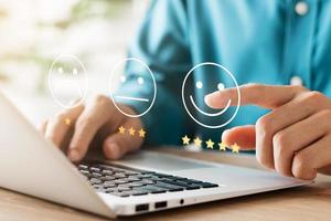 User give rating to service experience on online application, Customer review satisfaction feedback survey concept, Customer can evaluate quality of service leading to reputation ranking of business. photo